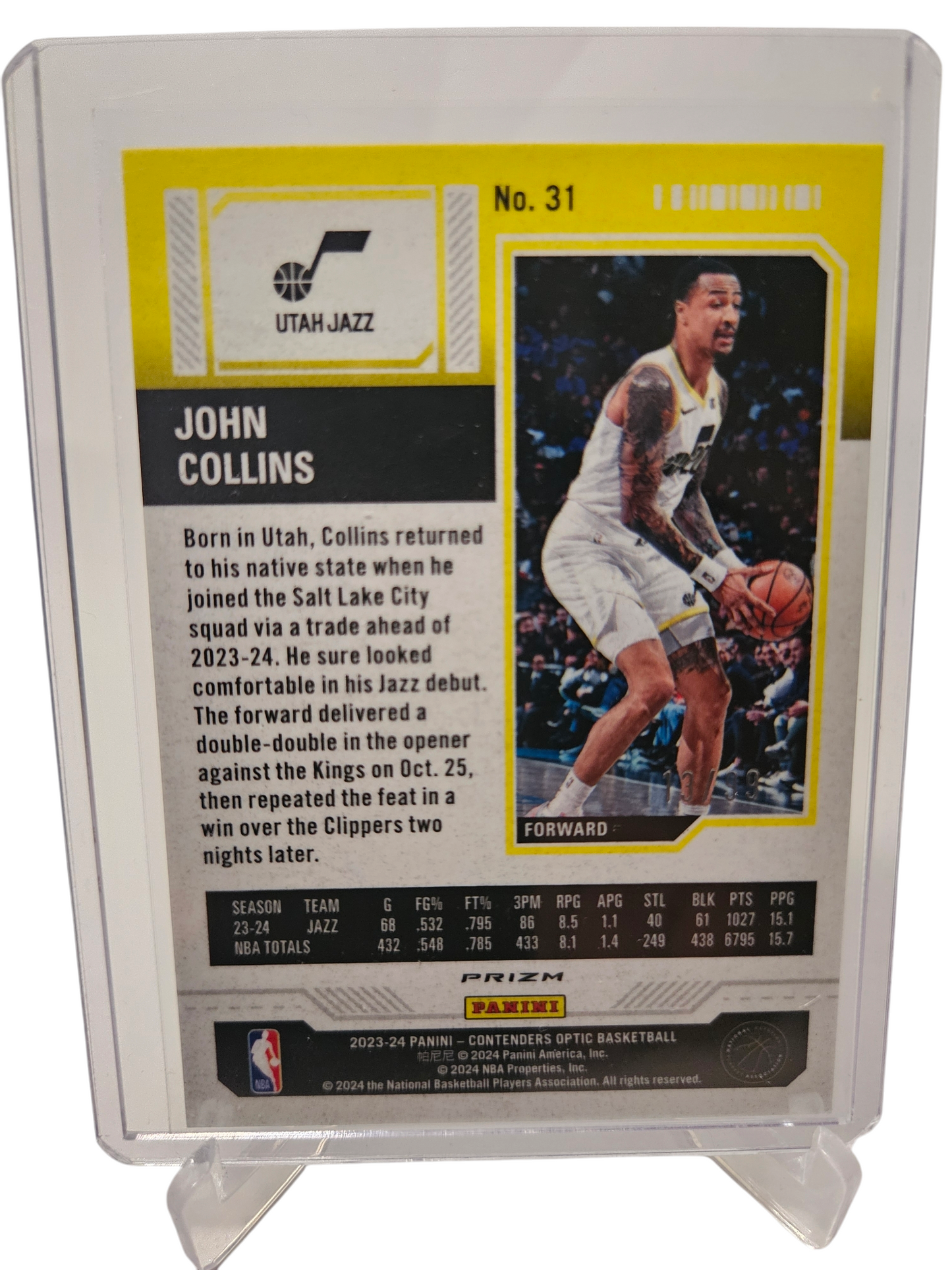 2023-24 Panini Contenders Optic #31 John Collins Season Ticket Blue Prizm 13/99