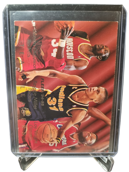 1995 Fleer #4 of 9 Hakeem Olajuwon/Reggie Miller/Loy Vaught Team Leaders